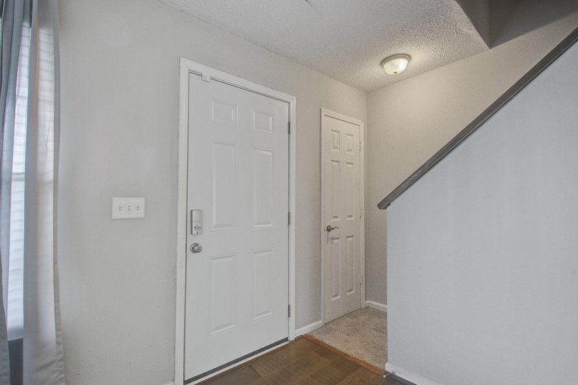 Move in ready two bedroom townhouse featuring a cozy fireplace - photo 4