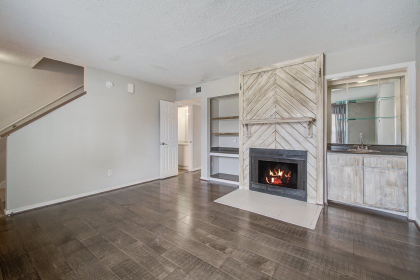 Move in ready two bedroom townhouse featuring a cozy fireplace - photo 7