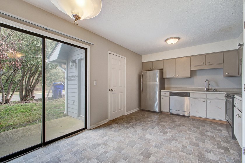 Move in ready two bedroom townhouse featuring a cozy fireplace - photo 10