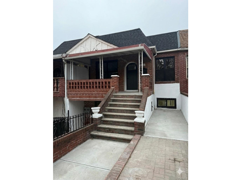 Experience modern luxury in this fully renovated two-family - photo 13