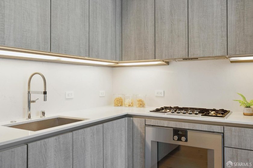 Step into this stunning top-floor 1-bedroom, 1.5-bathroom home - photo 9