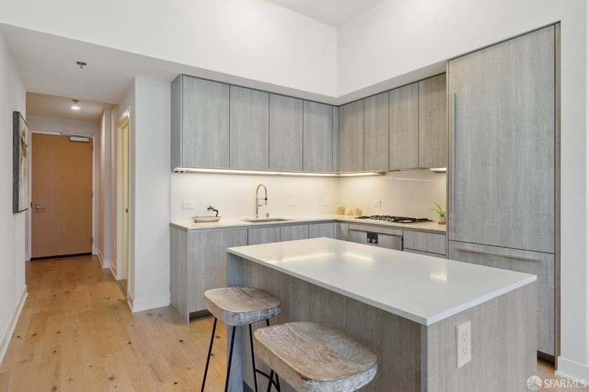 Step into this stunning top-floor 1-bedroom, 1.5-bathroom home - photo 10