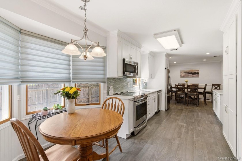 Welcome to this beautifully updated L-Shaped Ranch nestled in - photo 8