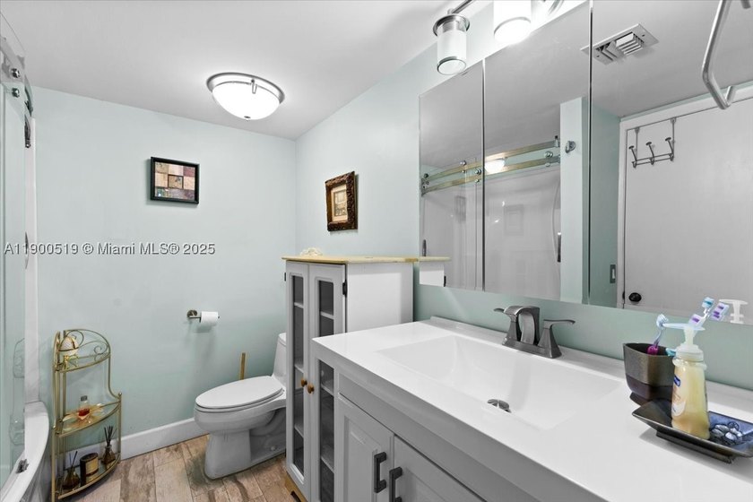 Welcome to this beautifully upgraded corner unit condo in the - photo 14