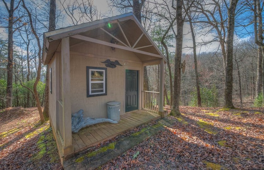 Located on 5.73 acres of UNRESTRICTED wooded land, this - photo 11