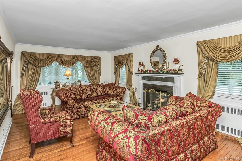 Set on a manicured corner lot in Bayside, this expanded Colonial - photo 5