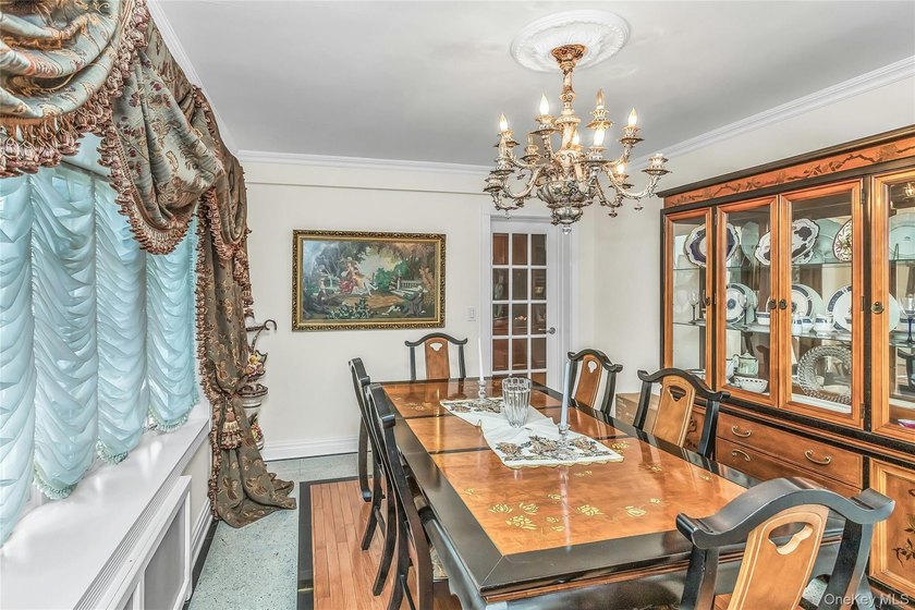 Set on a manicured corner lot in Bayside, this expanded Colonial - photo 8