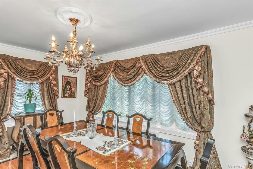 Set on a manicured corner lot in Bayside, this expanded Colonial - photo 9