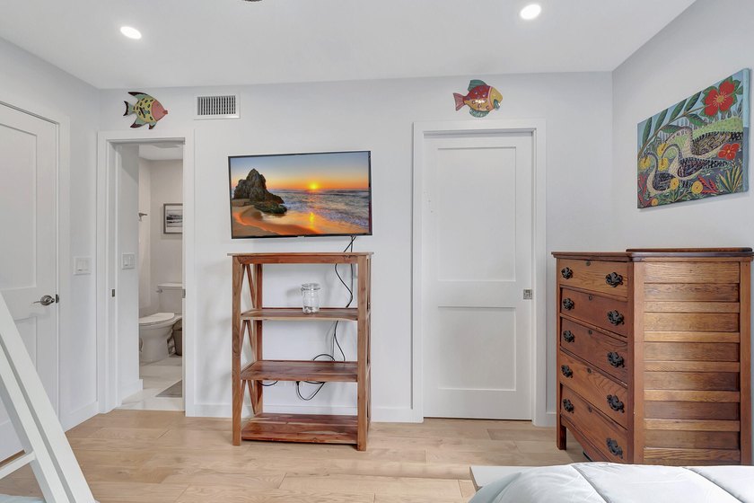 Envision residing just steps away from the serene beachfront of - photo 11