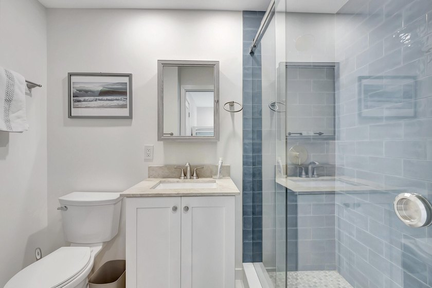 Envision residing just steps away from the serene beachfront of - photo 12