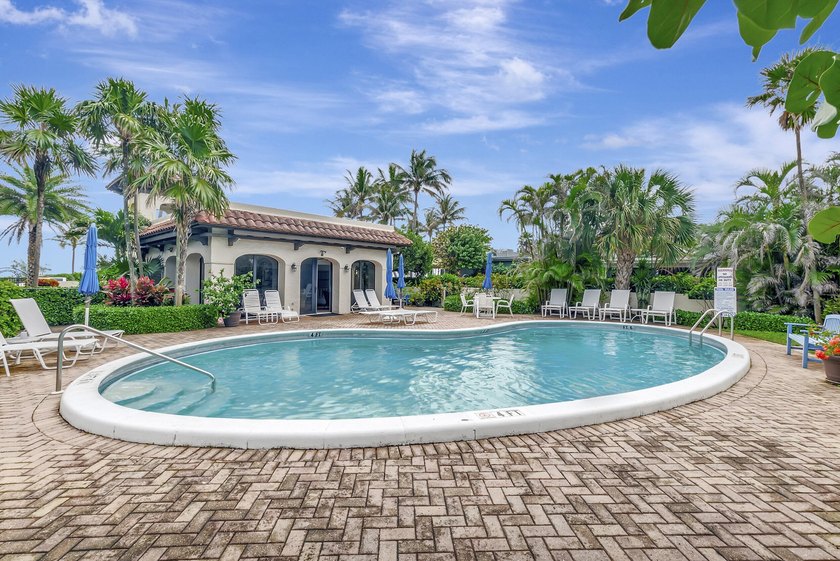 Envision residing just steps away from the serene beachfront of - photo 16