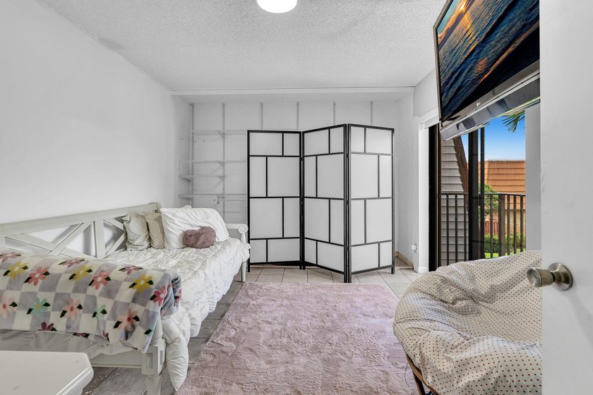 This spacious, light-filled residence features a beautifully - photo 18