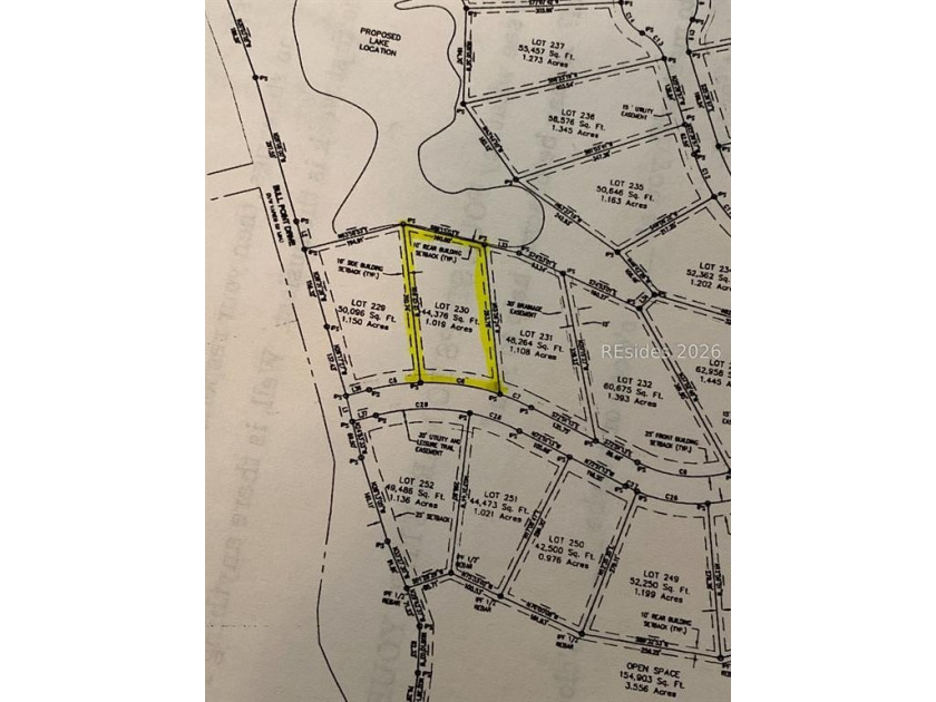 This 1.02 acre wooded lot has a rear lagoon view and is located - photo 3