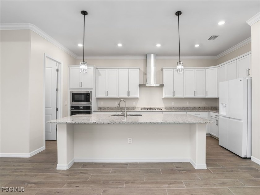 Live where others vacation in this Calusa model, overlooking the - photo 10
