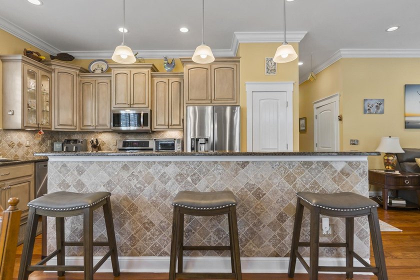 Four-bedroom, three-bathroom, elevated coastal home with a - photo 6