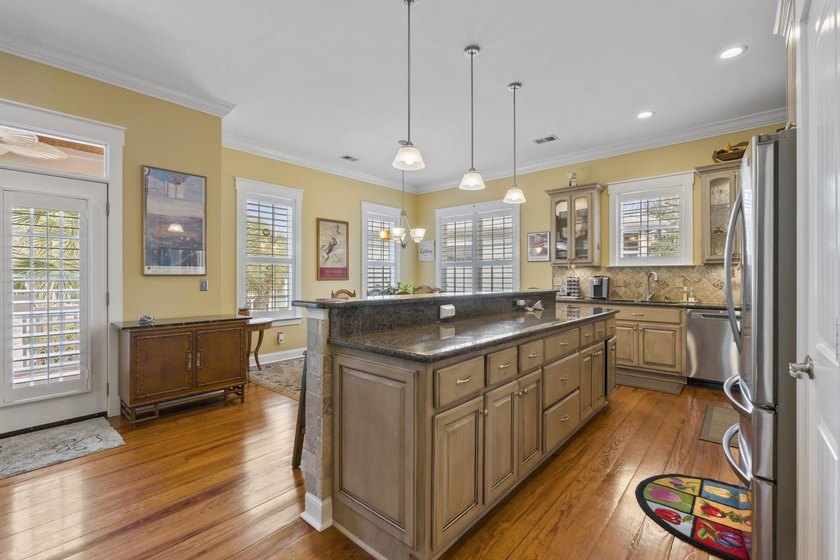 Four-bedroom, three-bathroom, elevated coastal home with a - photo 10