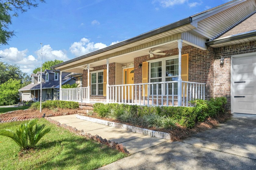 Rarely available in Niceville, this single-level pool and spa - photo 2