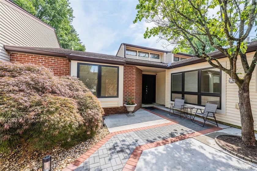 Welcome to this elegant gated condominium in the highly - photo 2