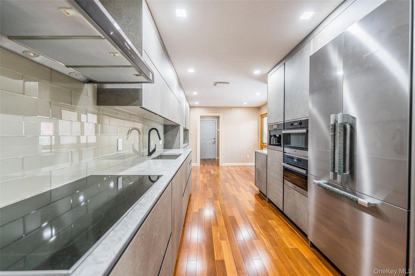 Welcome to this elegant gated condominium in the highly - photo 6