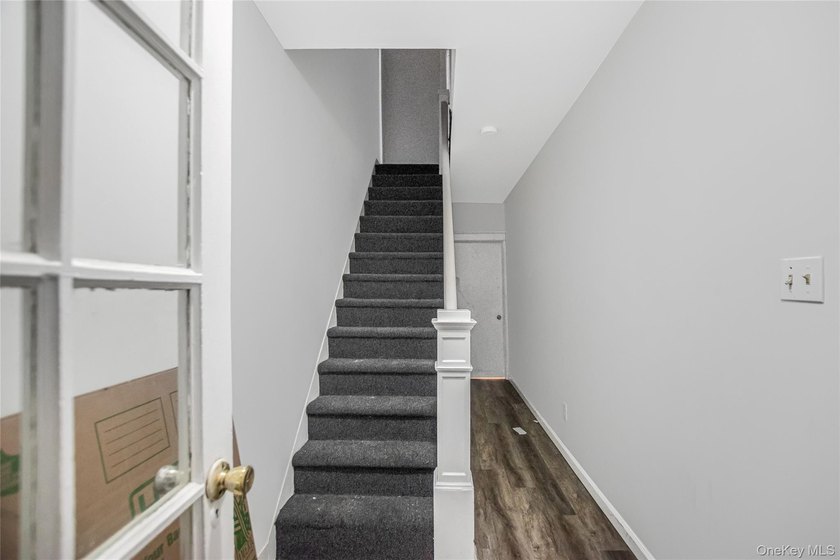 Welcome to this beautiful legal two-family home located in the - photo 2