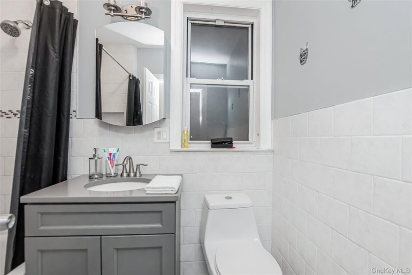 Welcome to this beautiful legal two-family home located in the - photo 3