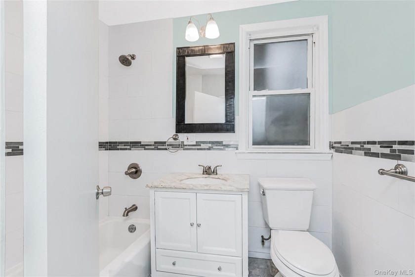 Welcome to this beautiful legal two-family home located in the - photo 4