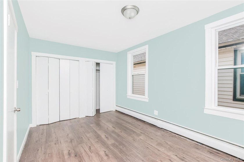 Welcome to this beautiful legal two-family home located in the - photo 5