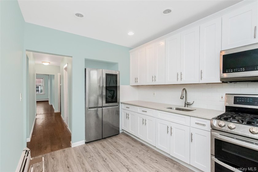 Welcome to this beautiful legal two-family home located in the - photo 8