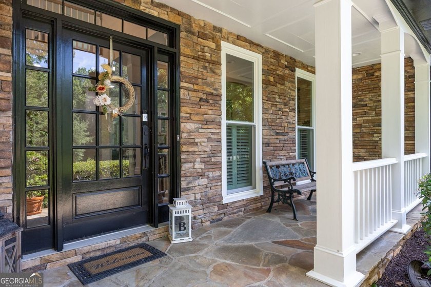 Tucked away on a beautifully landscaped lot of over 1 acre, this - photo 4