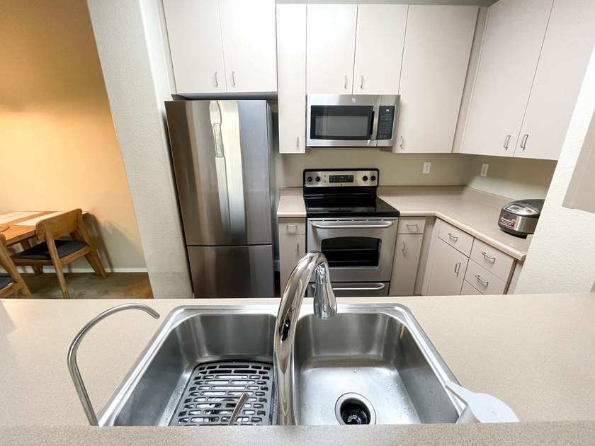 Discover this charming top-floor condo nestled in the - photo 12