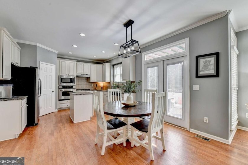 Discover your dream home in Hampton Golf Village! This stunning - photo 7