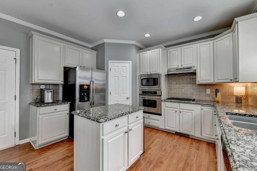 Discover your dream home in Hampton Golf Village! This stunning - photo 9