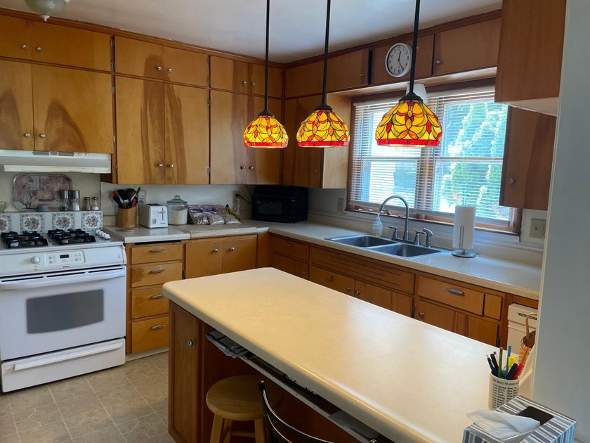 This inviting 4-bedroom, 2 bath home offers a bright layout with - photo 7