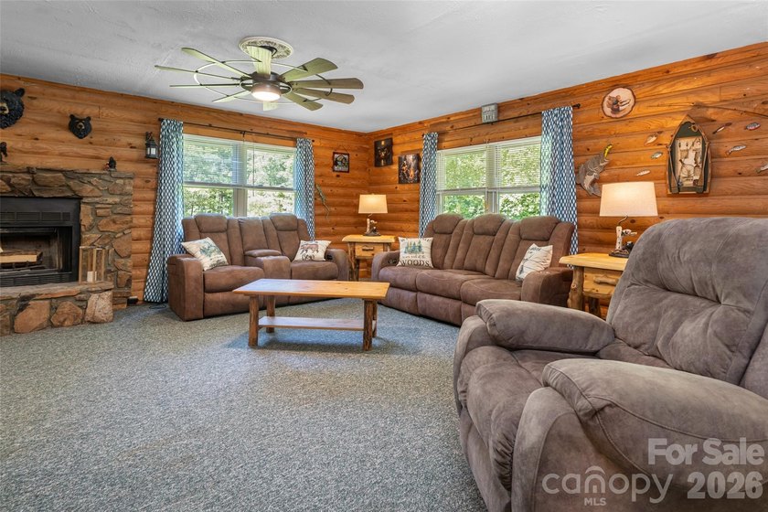 Escape to the mountains in this custom log cabin located in the - photo 8
