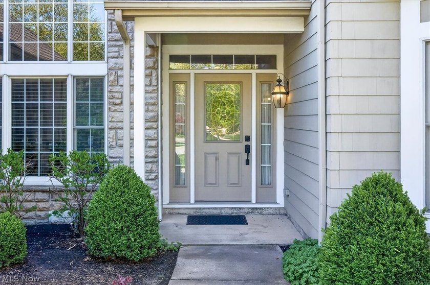 Discover this beautifully updated 3-bedroom cluster home in the - photo 3