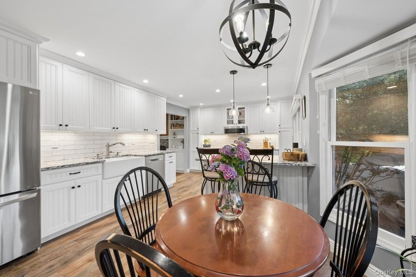 The brick driveway and lovely porch welcome you to this turnkey - photo 11