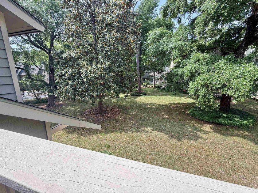 Updated and attractive second-floor end-unit villa featuring two - photo 12