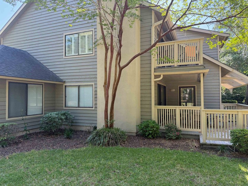 Updated and attractive second-floor end-unit villa featuring two - photo 16
