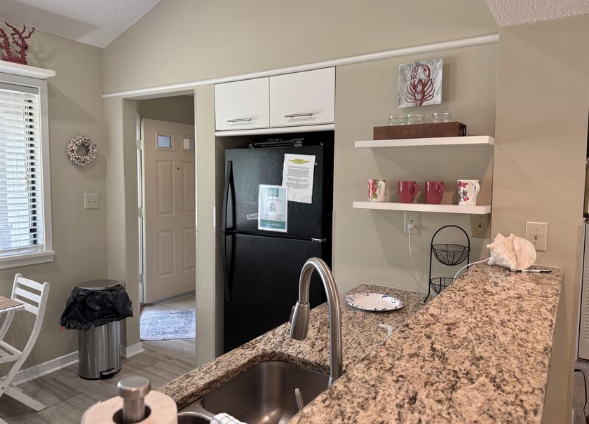 Updated and attractive second-floor end-unit villa featuring two - photo 23