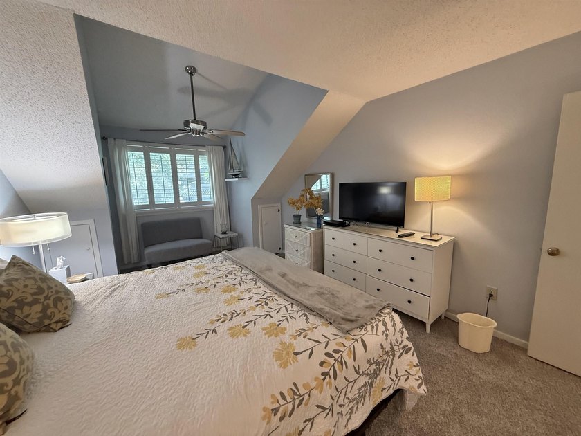 Updated and attractive second-floor end-unit villa featuring two - photo 29