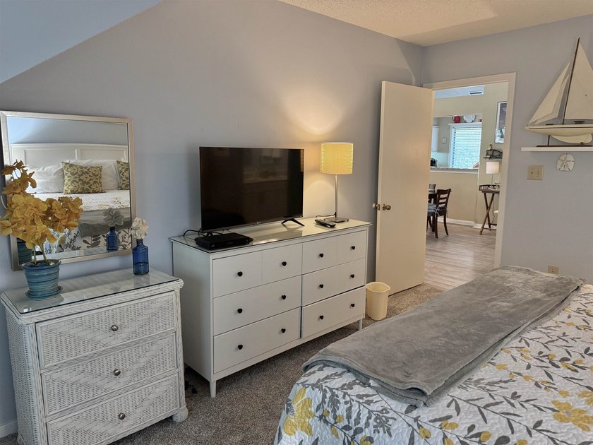 Updated and attractive second-floor end-unit villa featuring two - photo 33
