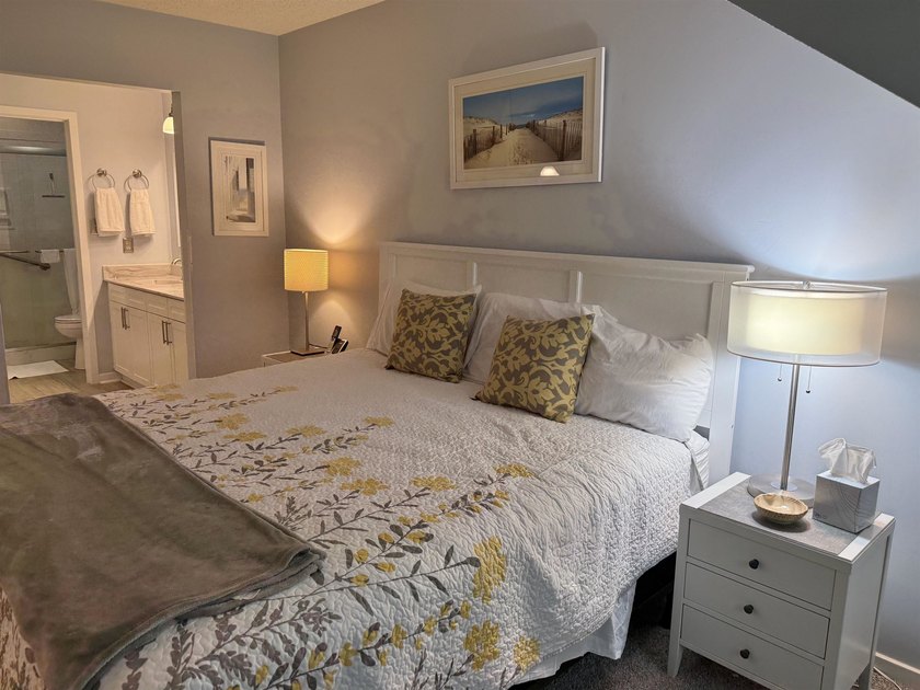 Updated and attractive second-floor end-unit villa featuring two - photo 34