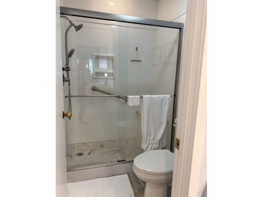 Updated and attractive second-floor end-unit villa featuring two - photo 36