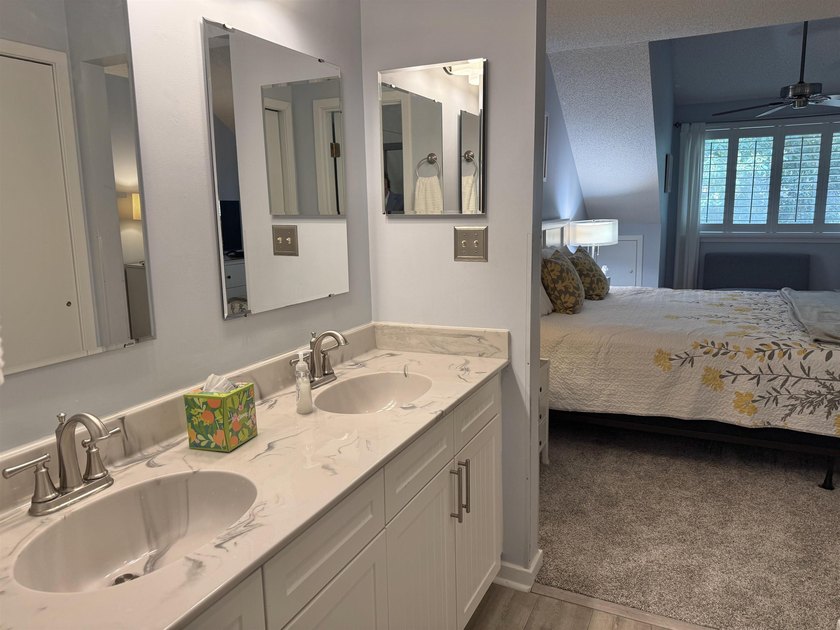 Updated and attractive second-floor end-unit villa featuring two - photo 37