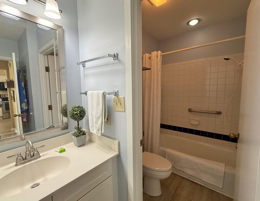 Updated and attractive second-floor end-unit villa featuring two - photo 39