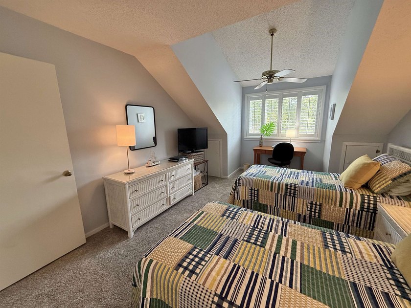 Updated and attractive second-floor end-unit villa featuring two - photo 40