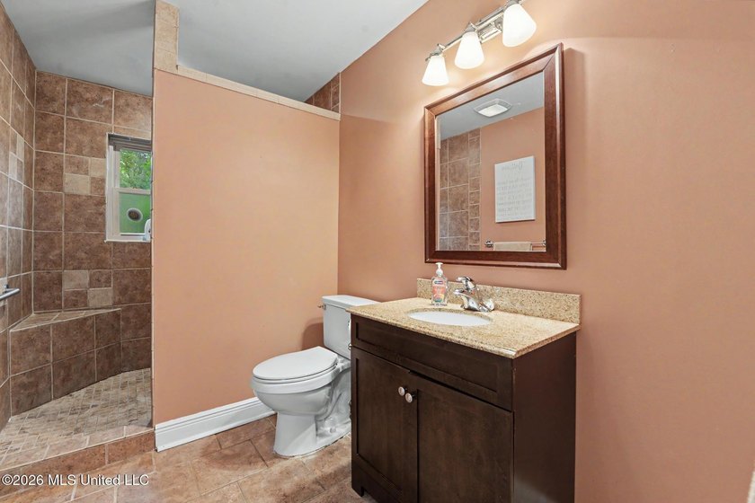 Situated on a quiet cul-de-sac in the heart of Diamondhead, this - photo 20