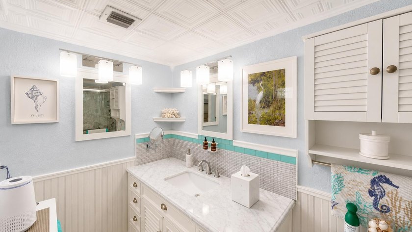 Waterfront living awaits in this beautifully maintained - photo 11