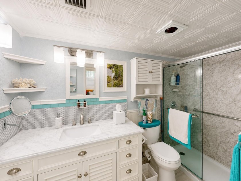 Waterfront living awaits in this beautifully maintained - photo 12