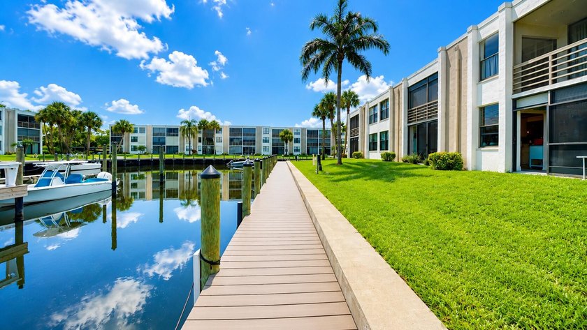 Waterfront living awaits in this beautifully maintained - photo 19